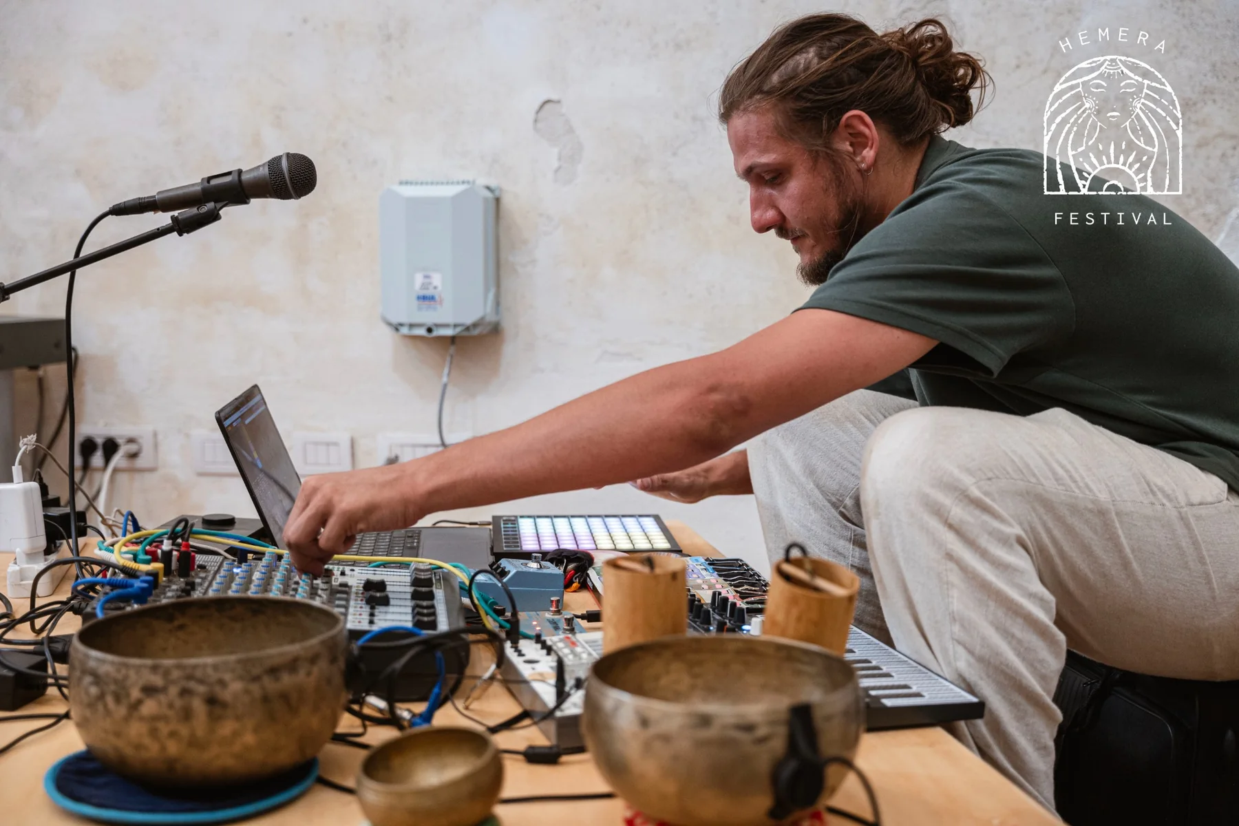Edmondo Riccardo Annoni performing live with electronics, microphones and singing bowls